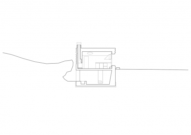 Exteriér - Lesní domek působí jako betonová skrýš
